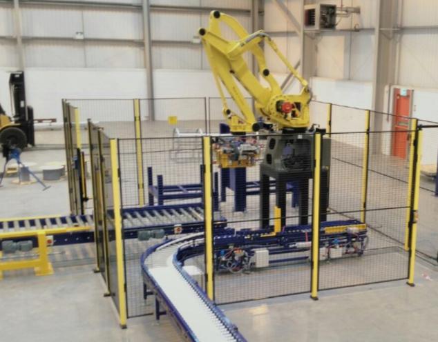 Conveyors into automatic robotic arm in automated system